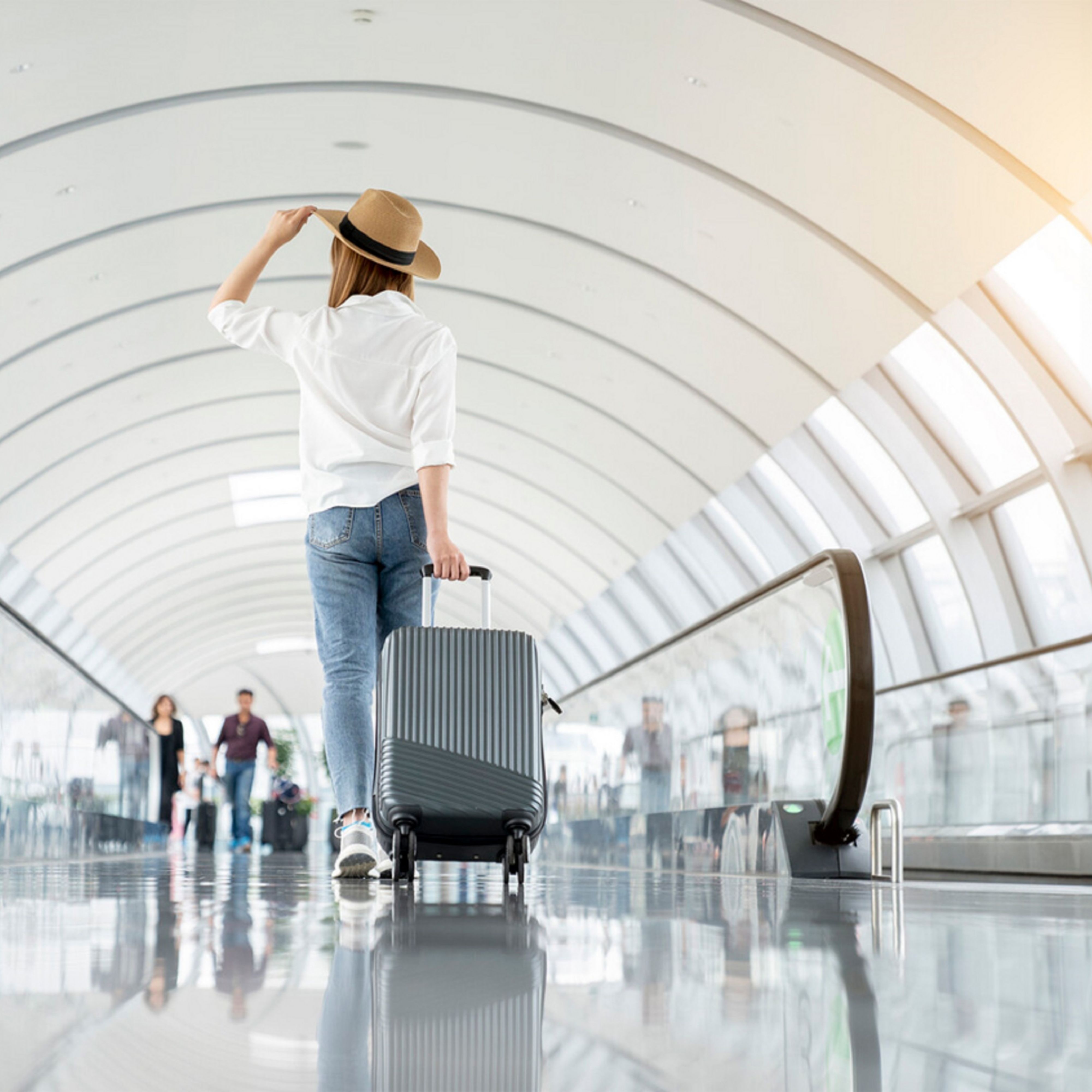Women in a hat at the airport