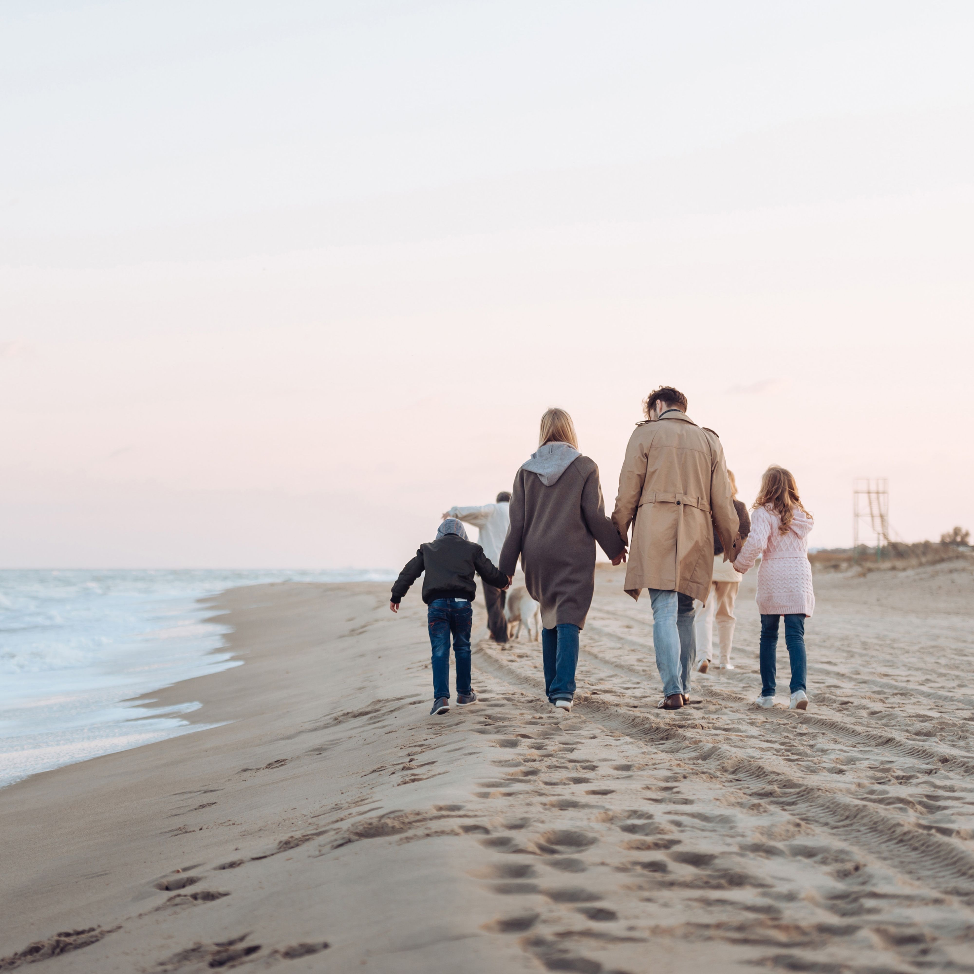 Family Walking on Sandy Beach